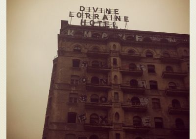 23-current_12-low-angle-closeup-exterior-with-signage-and-graffitti-min