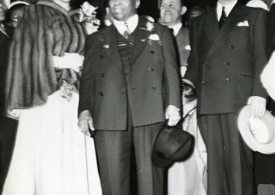 73-historic_59-b_w-close-up-photo-of-patrons-at-exterior-of-front-enterance-min