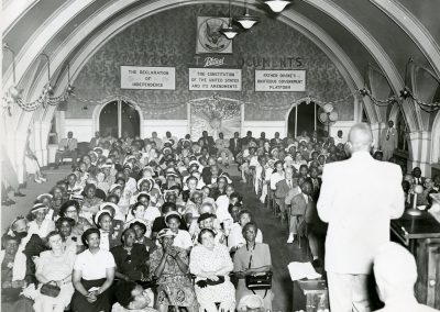 82-historic_68-b_w-photo-of-a-sermon-or-speaking-function-min