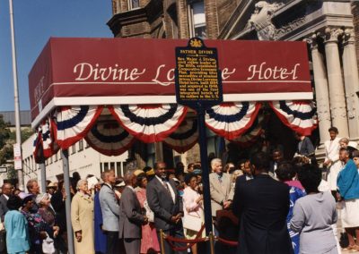 89-historic_75-close-up-color-right-angle-photo-of-front-enterance-including-father-divine-historic-signage-min